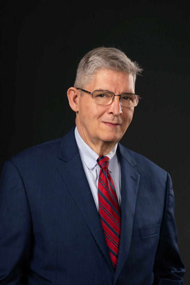 Professional headshot of a man
