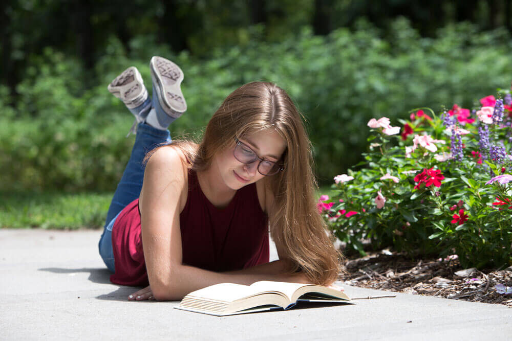 Senior portrait with books